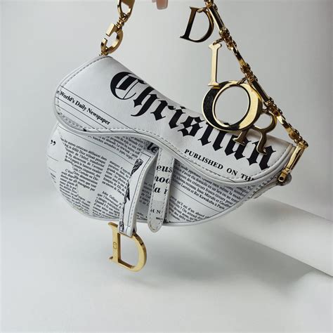 dior newspaper bag|Dior pierced saddle bag.